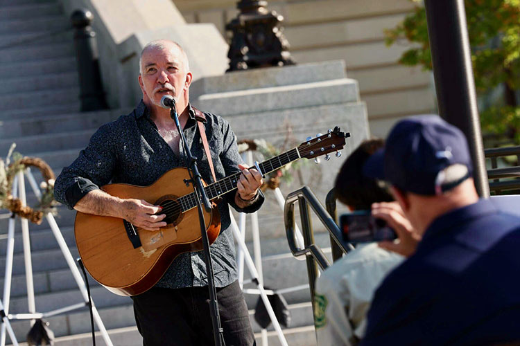James Keelaghan playing guitar