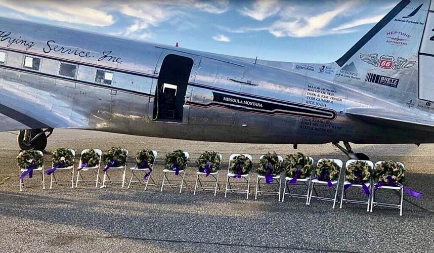 wreathss on chairs in front of airplane